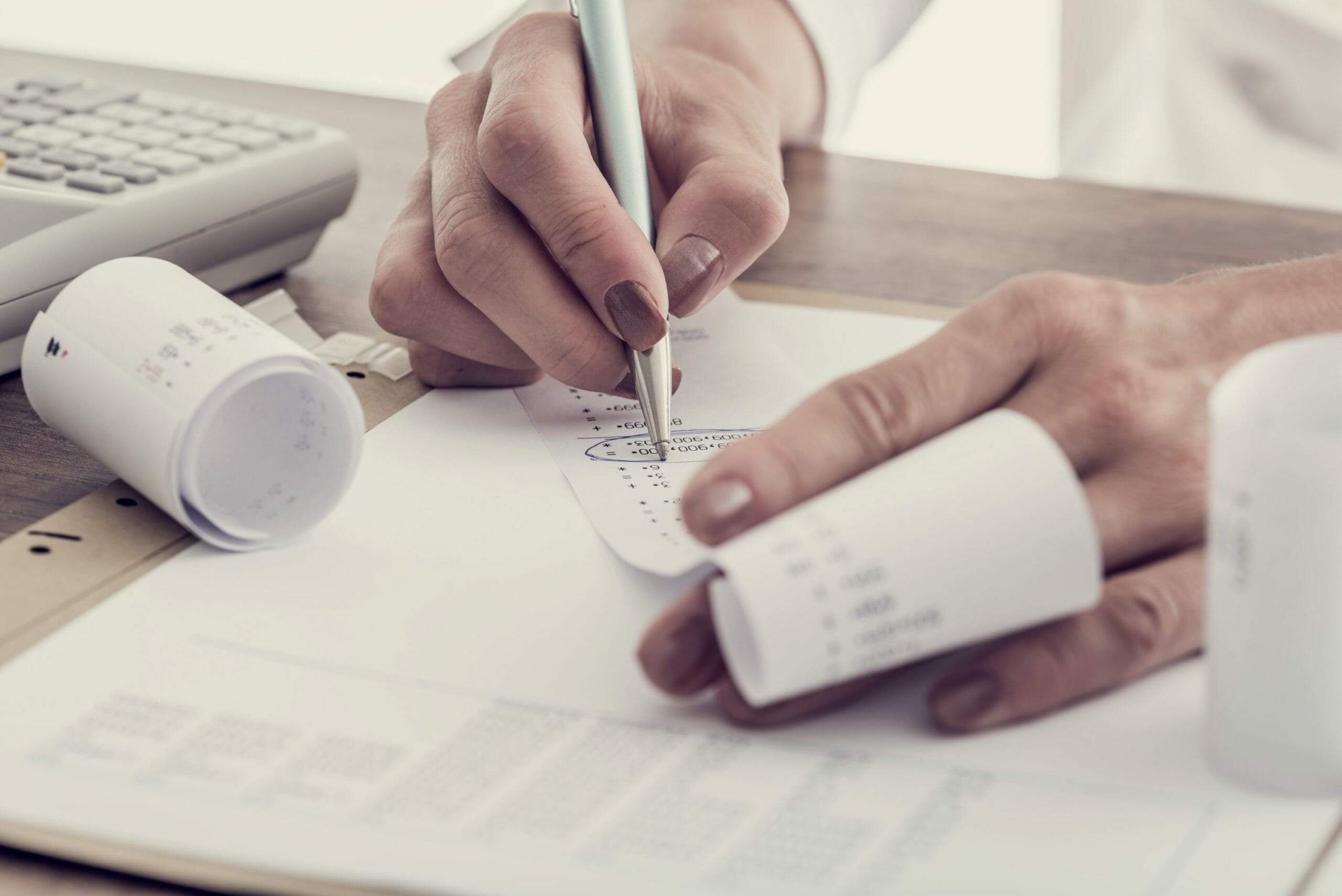 accountant-working-at-her-desk-PTBWJAY
